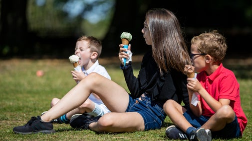 Children eating ice cream in the garden at Polesden Lacey, Surrey